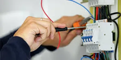 An electrician working on wirings